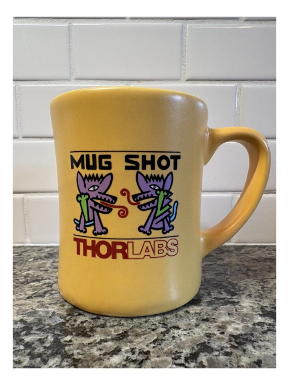 Yellow ThorLabs Mug Shot coffee mug
